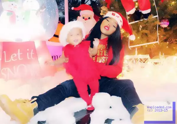 Lil Kim looks like a Chinese woman in her Christmas card